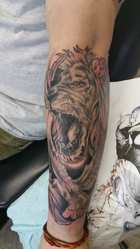 Explore blessed neck tattoo ideas, creative tattoo ideas in Storm Lake, available at Alley Cat Tattoo