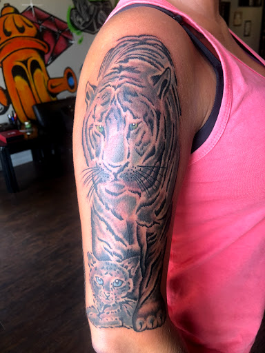 Explore ladies neck tattoo ideas, creative tattoo ideas in Cape Coral, available at UNRIVALED INK