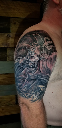 Explore dog tags tattoo ideas, creative tattoo ideas in Talbott, available at Alpha Tattoo co.