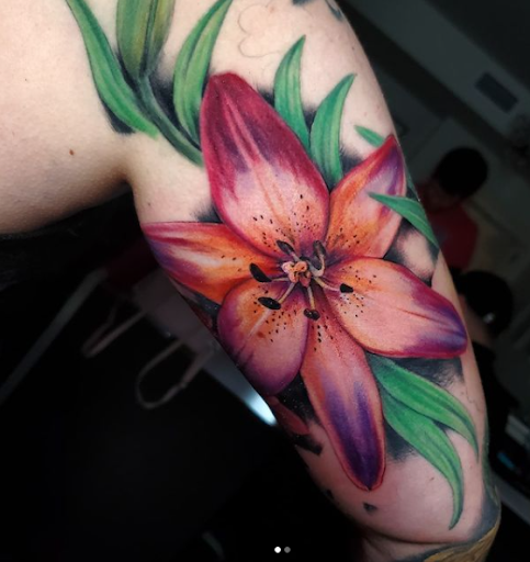 Explore arm blackout tattoo ideas, creative tattoo ideas in Tea, available at Red Arbor Tattoo