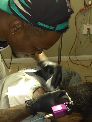 Explore name tattoo ideas for men, creative tattoo ideas in Atlanta, available at Iron Palm Tattoos & Body Piercing Atlanta