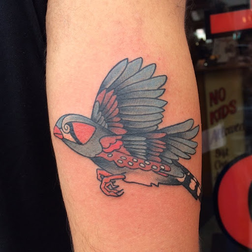 Explore ferret tattoo ideas, creative tattoo ideas in Chapel Hill, available at Golden Falcon Tattoo and Piercing