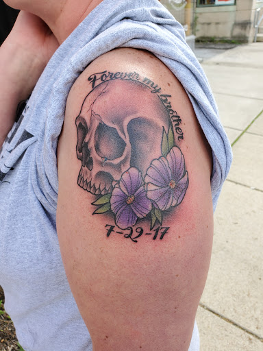 Explore tattoo ideas on ribs for men, creative tattoo ideas in West Jefferson, available at Black Dagger Tattoo Collective