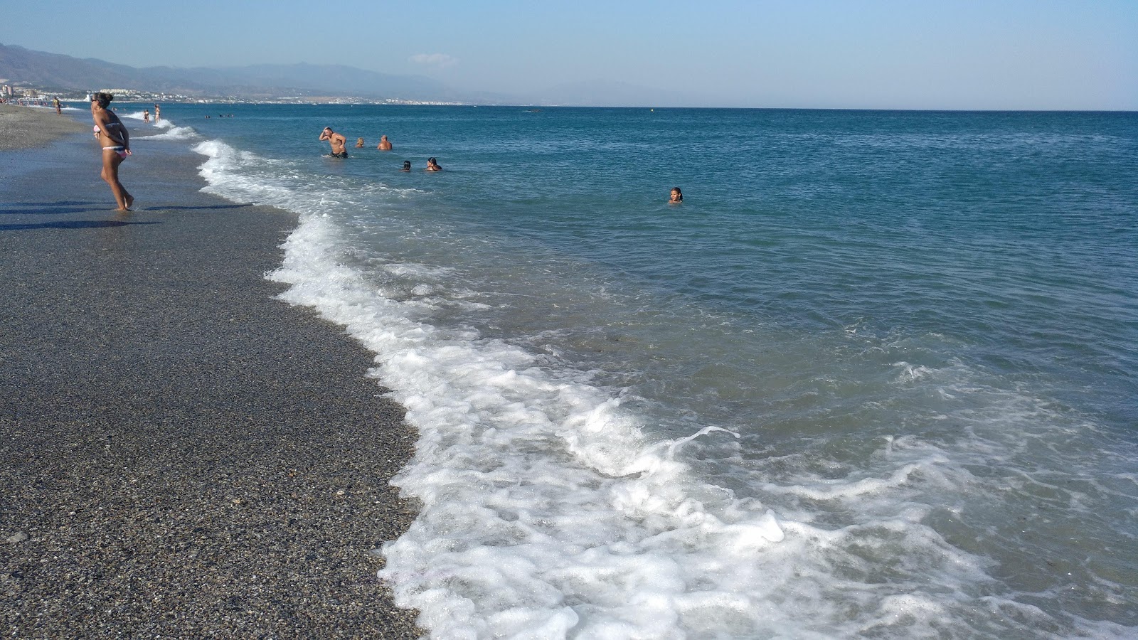 Foto von Playa los Toros mit reines blaues Oberfläche