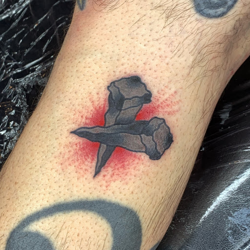 Explore ribbon tattoo ideas, creative tattoo ideas in Englishtown, available at Battlefront Tattoo Company