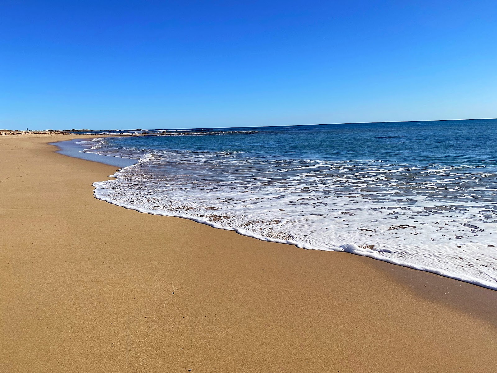 Seaspray Beach的照片 带有碧绿色纯水表面