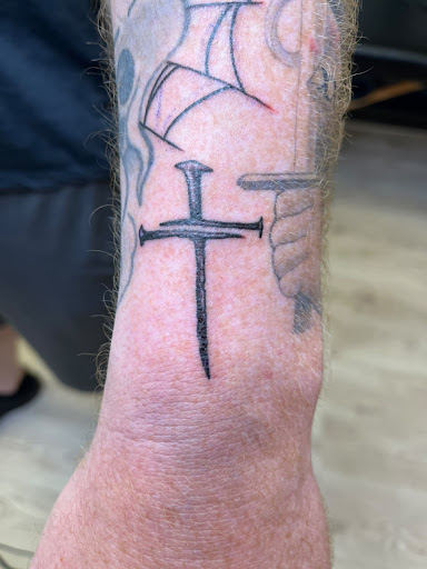 Explore middle arm tattoo ideas, creative tattoo ideas in Arlington, available at Benchmark Tattoos