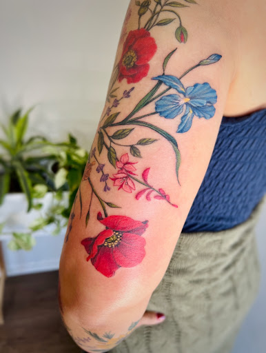 Explore black female tattoos ideas, creative tattoo ideas in Montrose, available at The Story Blossom Tattoo Studio