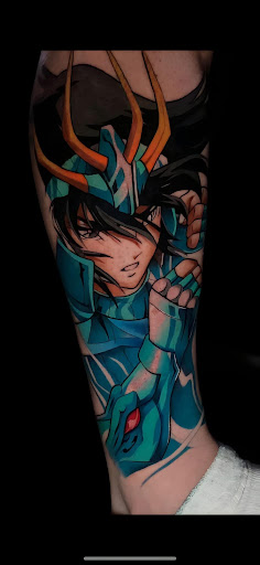 Explore stamp tattoo ideas, creative tattoo ideas in Denver, available at Viva La Raza Tattoo Club