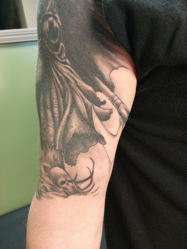 Explore darkness tattoo ideas, creative tattoo ideas in Saint Cloud, available at Wingnut Tattoo & Piercing Studio