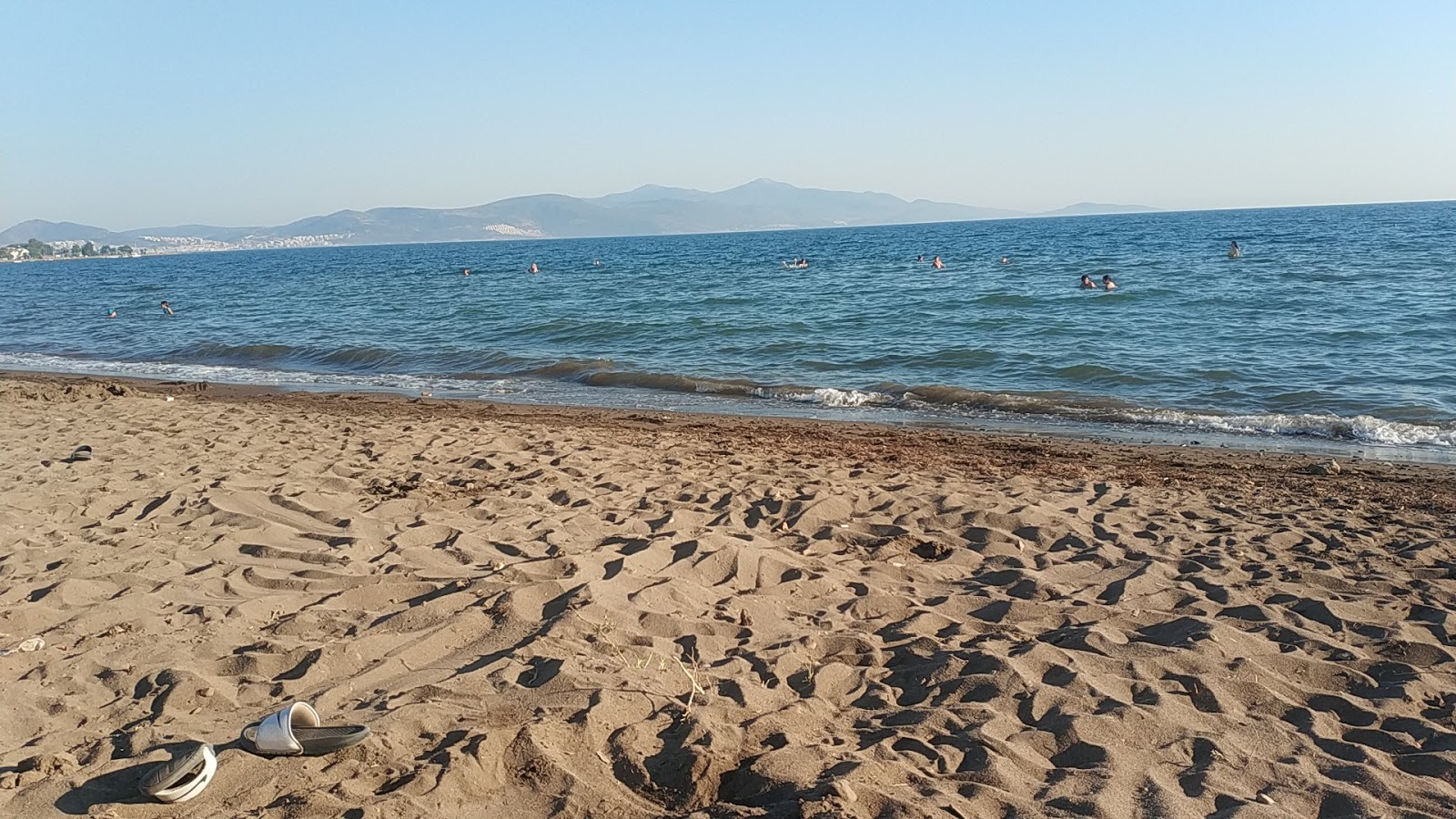 Foto av Tek Cinar beach med beige sand yta