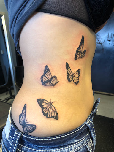 Explore karma tattoo ideas for men, creative tattoo ideas in San Angelo, available at A1 Tattoos and Piercings