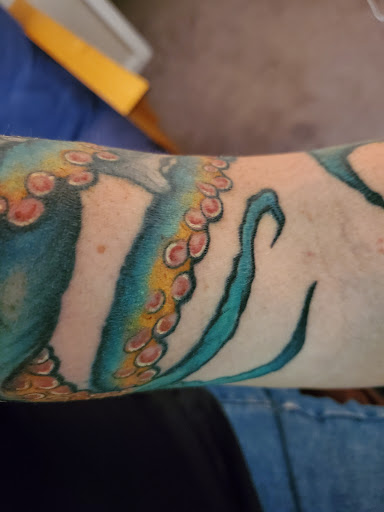 Explore hood tattoo ideas for men, creative tattoo ideas in Bethlehem, available at Obsidian Tattoo and Piercing Parlor