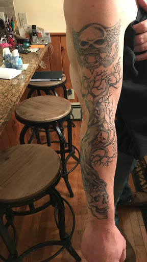 Explore tattoo sleeve skull ideas, creative tattoo ideas in North Conway, available at The Darling Grey Tattoo,Gallery & Piercing