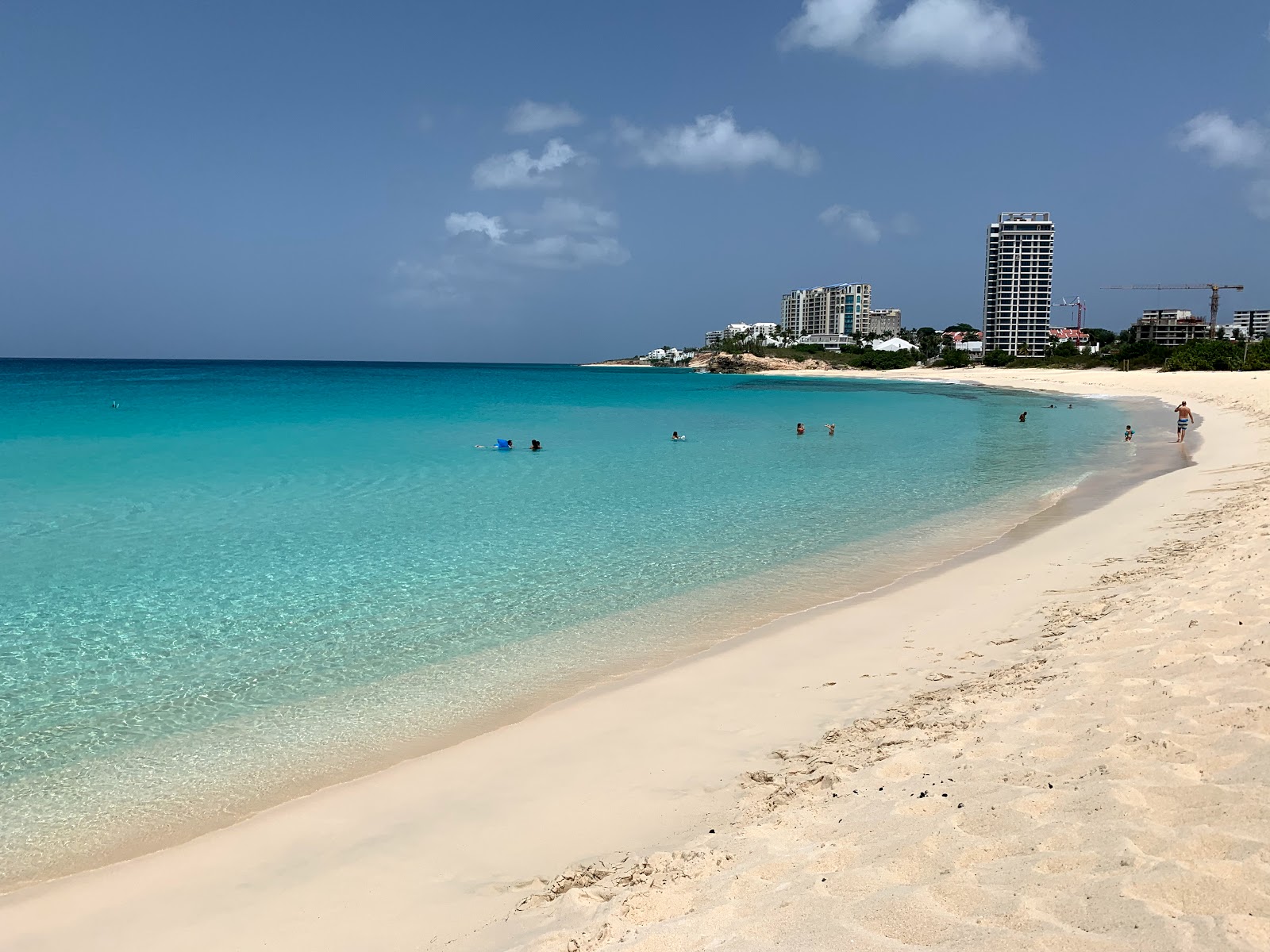 Photo of Mullet Bay beach with bright fine sand surface