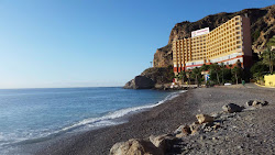 Photo de Playa del Palmer entouré de montagnes