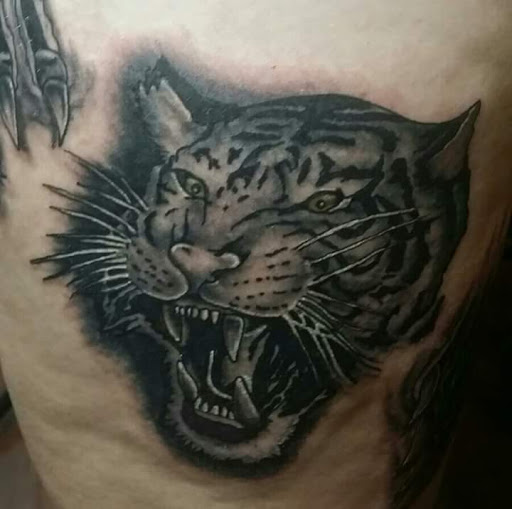 Explore colter wall tattoo ideas, creative tattoo ideas in Westland, available at Premier Tattoo Company Westland