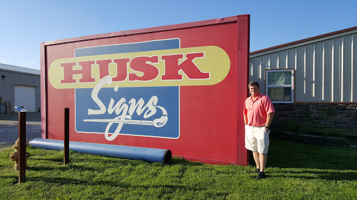 Husk Signs Inc