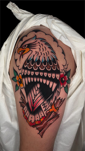 Explore bone tattoo ideas, creative tattoo ideas in Johnson City, available at Gold Cross Tattoo Co.