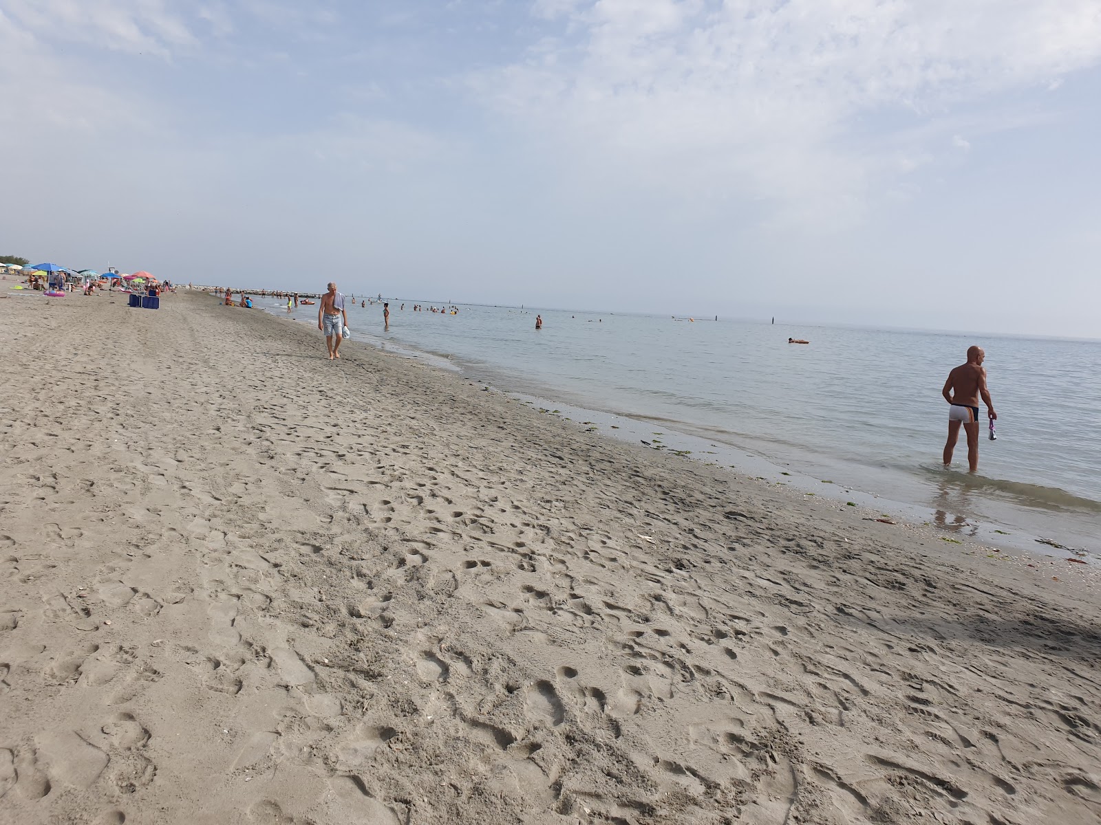 Fotografija Spiaggia della Bassona z turkizna čista voda površino