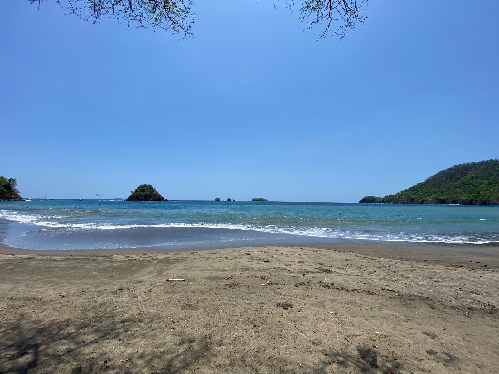Foto van Playa Grande met turquoise water oppervlakte