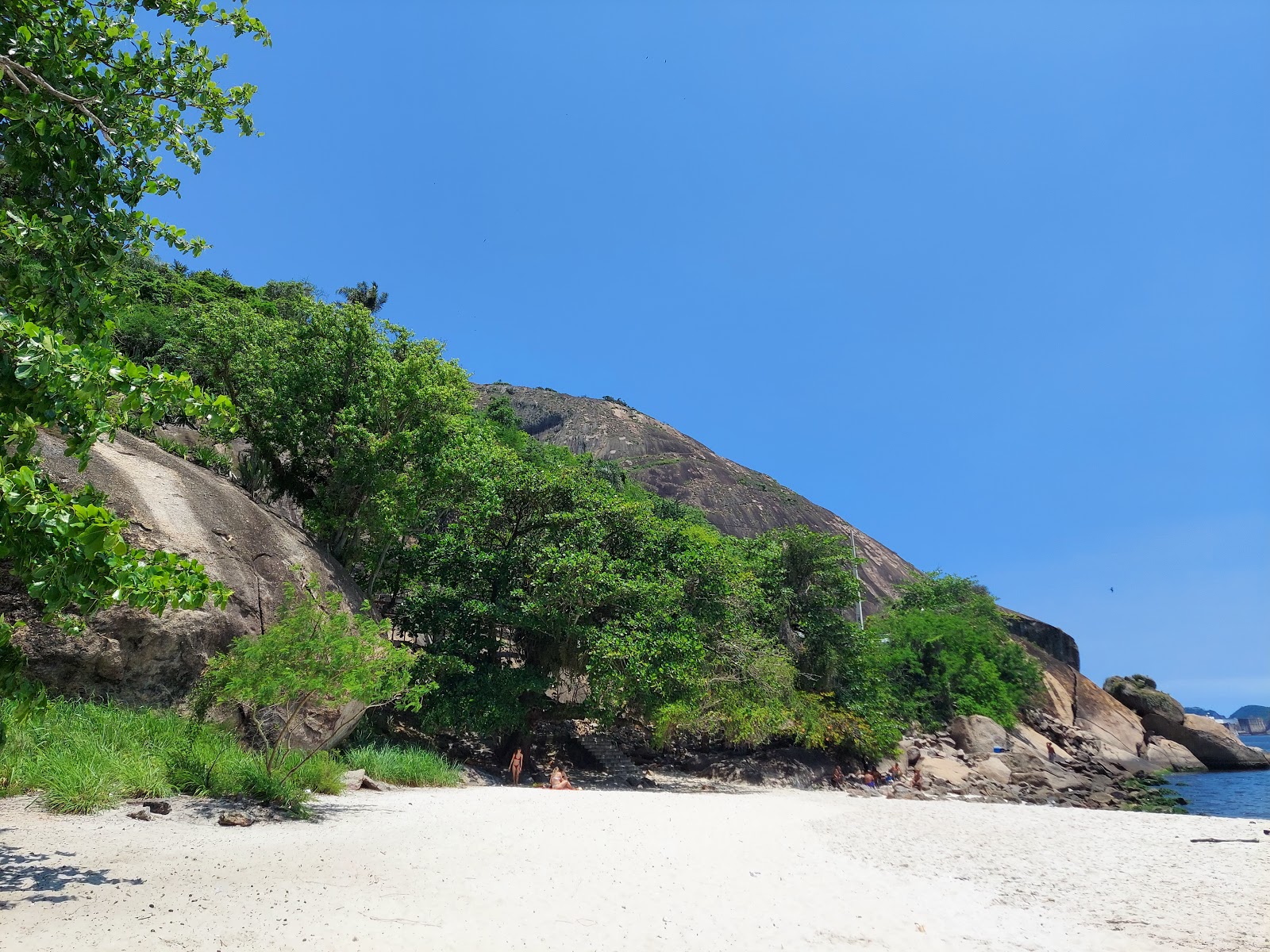 Photo of Adao Beach surrounded by mountains