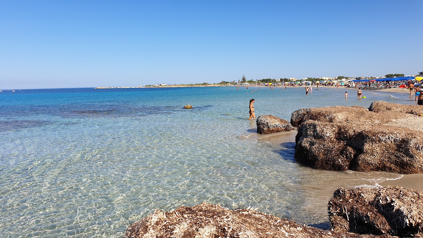 Zdjęcie Spiaggia Torrazza z powierzchnią beżowy piasek