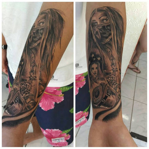 Logo da empresa - Evora Tattoo