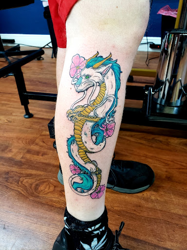 Explore behind neck tattoo ideas, creative tattoo ideas in Cocoa, available at Rorschach Tattoo Shop and Piercing Studio