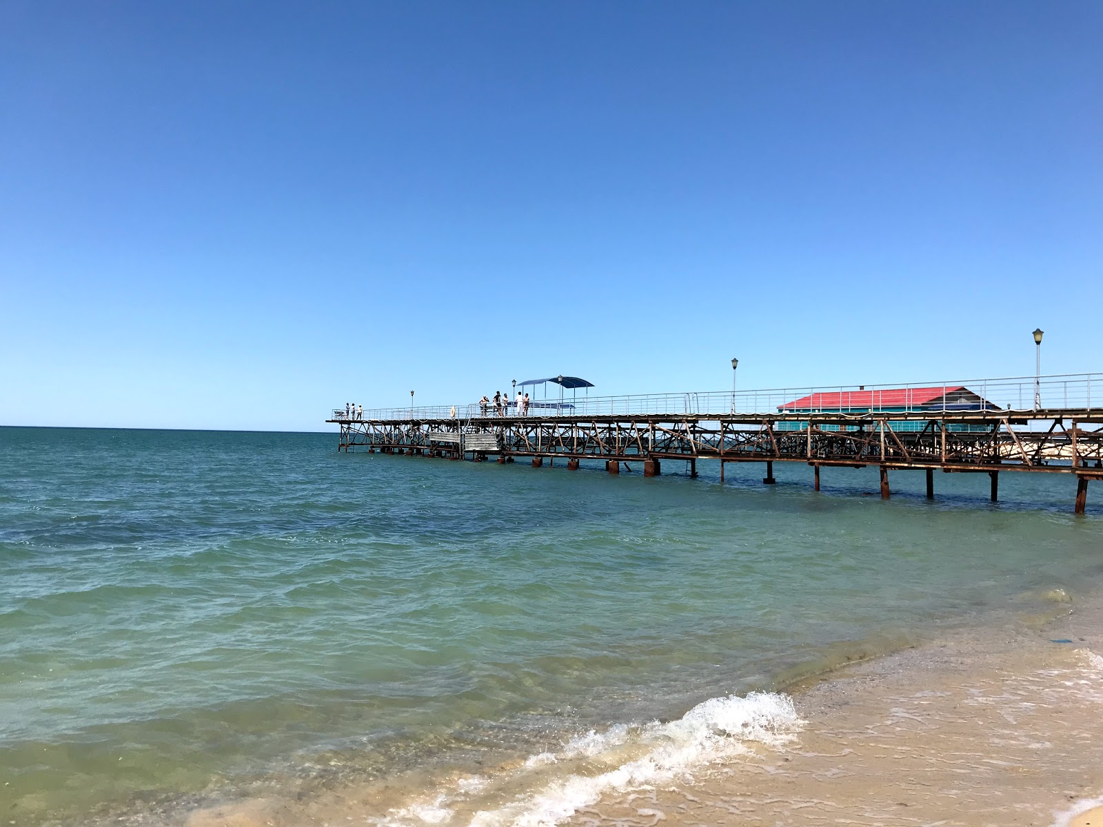 Foto de Stigl Beach com areia bege superfície