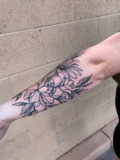 Find low back tattoo ideas for your next unique tattoo in Peoria at Modern Ink Tattoo