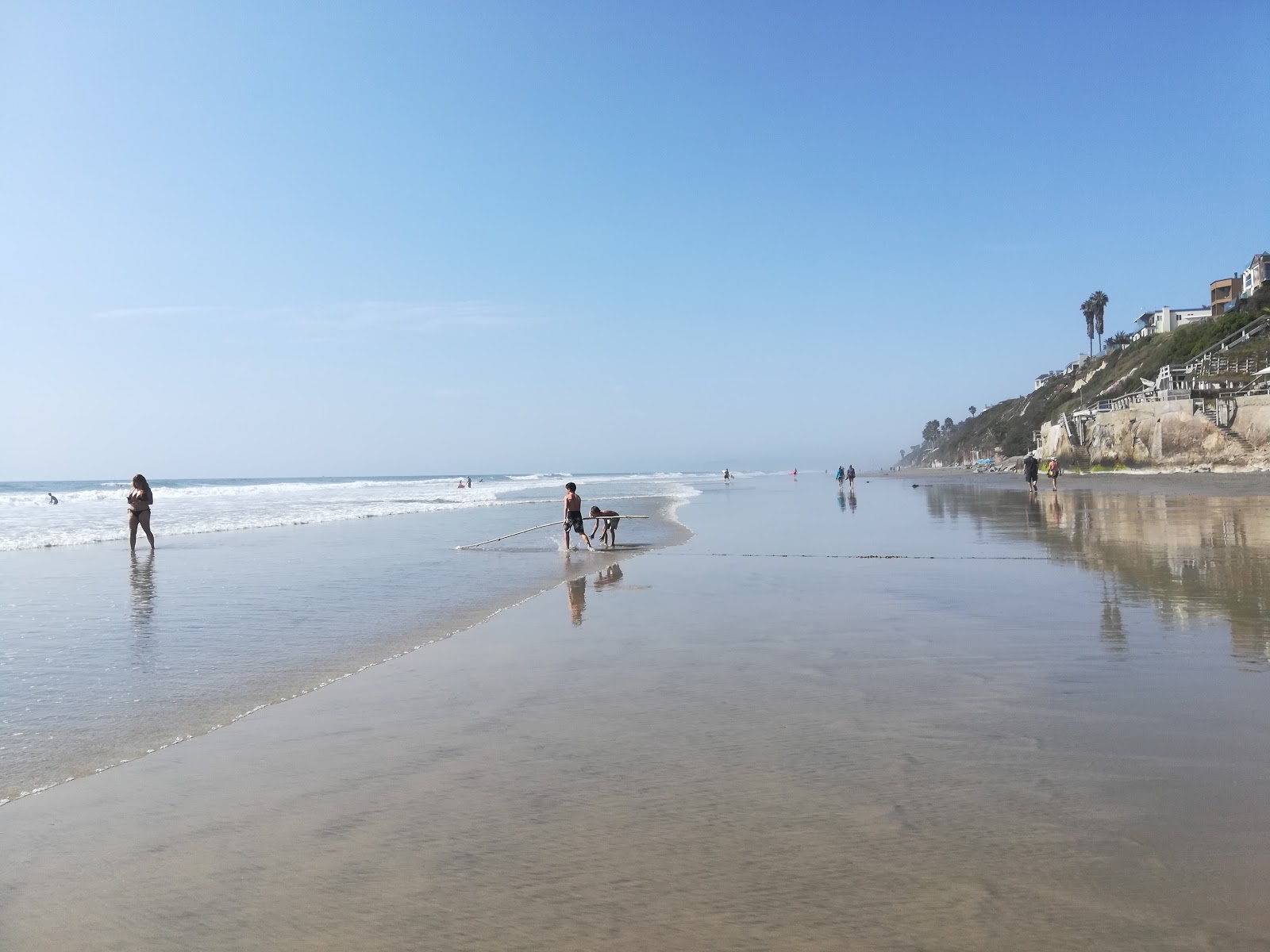 Photo of Leucadia beach with bright sand surface