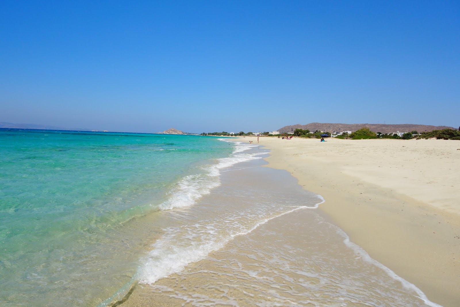 Foto von Glyfada Strand mit türkisfarbenes wasser Oberfläche
