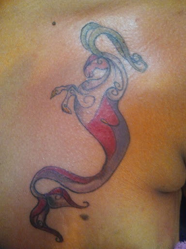 Explore cover up tattoo ideas lower back, creative tattoo ideas in Whitehall, available at Beachside Tattoos & Smoke Shop