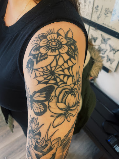 Explore wolf tattoo ideas for guys, creative tattoo ideas in Concord, available at Sterling Tattoo Club