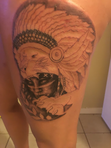 Explore cross tattoo sleeve ideas, creative tattoo ideas in Arlington, available at Urbans Tattoo & Piercing Studio