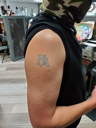 Explore rose tattoo cover up ideas, creative tattoo ideas in Nashville, available at Titan Tattoo