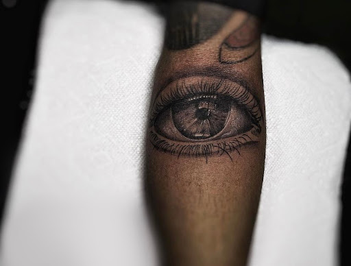 Explore hockey tattoo ideas, creative tattoo ideas in Lavonia, available at 1890 Tattoo Co.