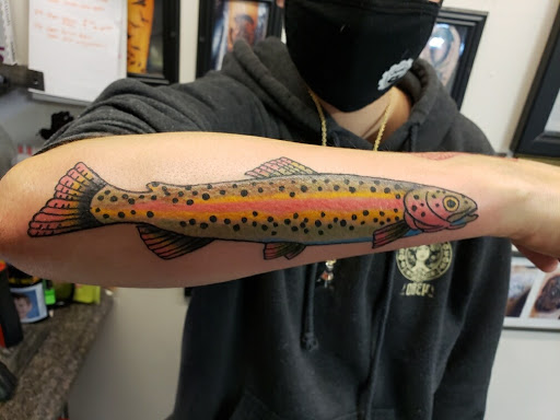 Explore blackout tattoo cover up ideas, creative tattoo ideas in Alamosa, available at The Shop Tattoo & Comics