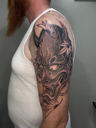 Explore tattoo ideas skull and roses, creative tattoo ideas in Amherst, available at Wanderlust Tattoo & Piercing