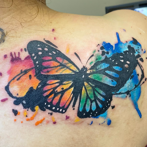 Explore feather tattoo ideas for men, creative tattoo ideas in Calhoun, available at Ink Factory Tattoos