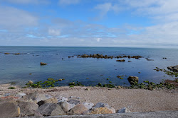 Photo de Monks Bay entouré de montagnes