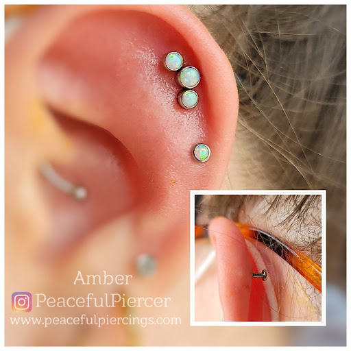 Find garter belt tattoo ideas for your next unique tattoo in Monroe at Peaceful Piercings LLC