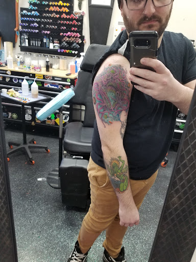Explore jawline tattoo ideas, creative tattoo ideas in Slippery Rock, available at Dinky Dachshund Tattoo Parlor