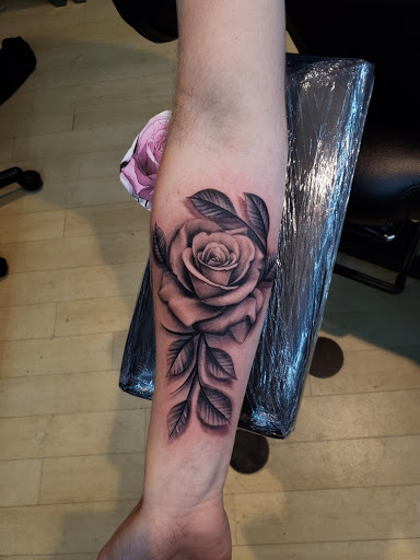 Explore brass knuckle tattoo ideas, creative tattoo ideas in Fort Wayne, available at Grade A Tattoos and Body Piercing