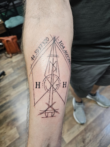 Explore religious elbow tattoo ideas, creative tattoo ideas in Redding, available at The Salty Sloth Tattoo