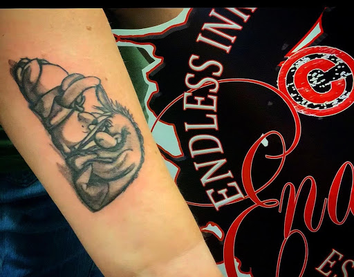 Explore black out tattoo ideas, creative tattoo ideas in Denver, available at Endless Ink Tattoo & Piercing