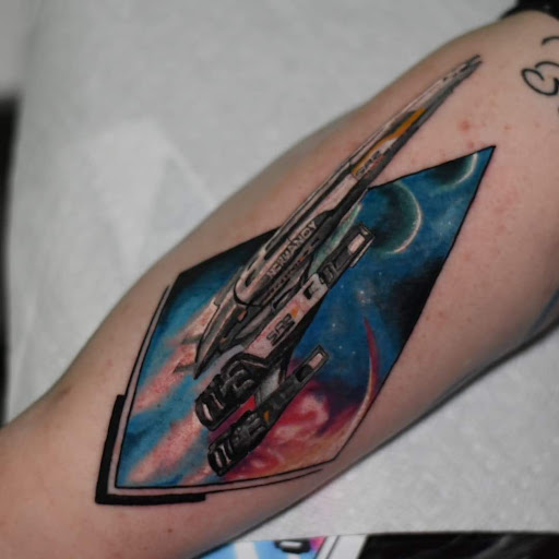 Explore men's shin tattoo ideas, creative tattoo ideas in Greenfield, available at Garden of Eden Tattoos