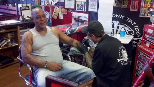 Explore five finger death punch tattoo ideas, creative tattoo ideas in Anderson, available at FearlessTattoos and Piercing