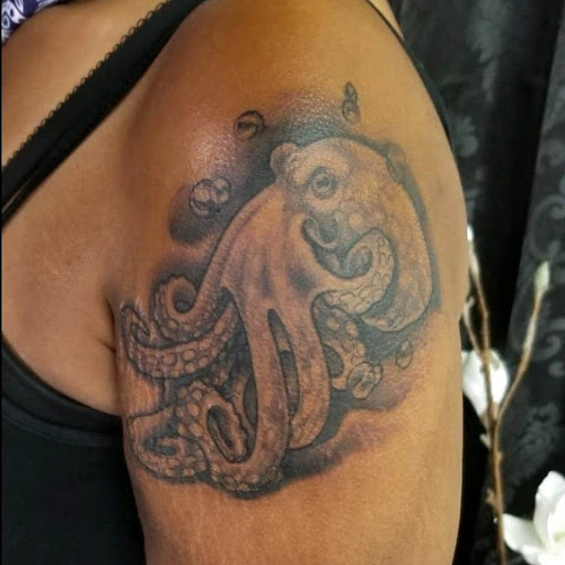 Explore sink or swim tattoo ideas, creative tattoo ideas in Mebane, available at The Cardinal Skin Art & Gallery
